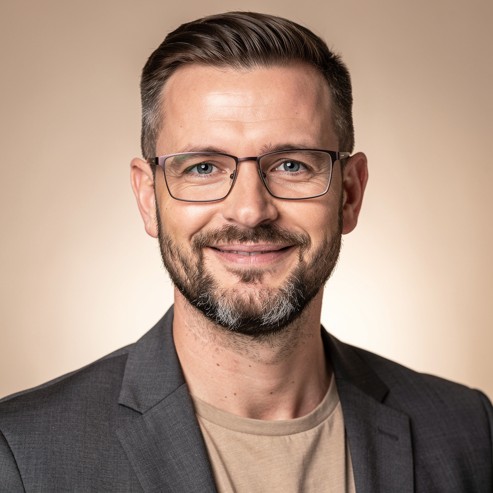 Portrait of a bearded man in glasses, media instructor